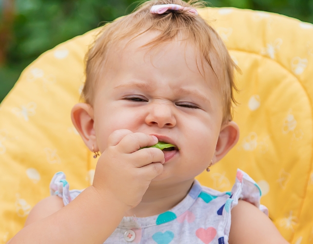 baby eating broccoli