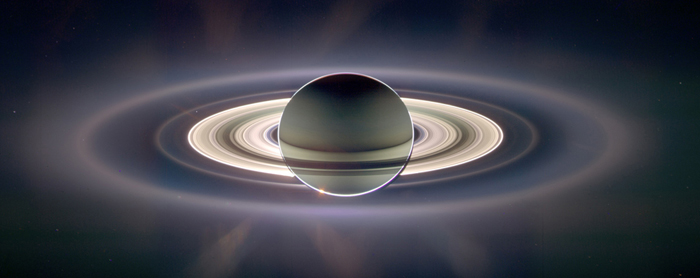 saturn's rings backlit by the sun