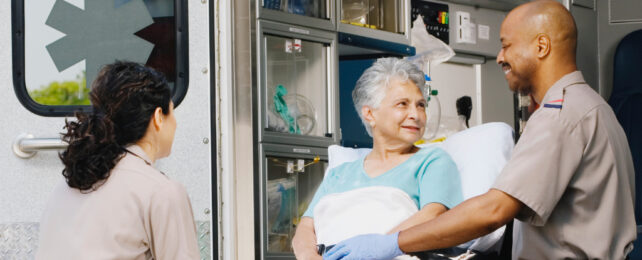 paramedics with elderly person